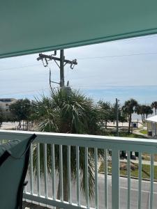 a view of the beach from a balcony at Sky Blue 321 in Cedar Key