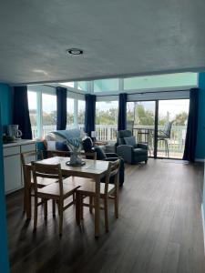 a living room with a table and a couch at Sky Blue 321 in Cedar Key