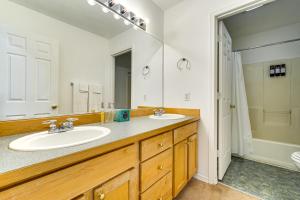 a bathroom with two sinks and a large mirror at 6 Mi to Microsoft HQ! Remote Work Retreat in Redmond +25 photos