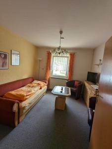 Postel nebo postele na pokoji v ubytování Gästehaus Stein im Thüringer Wald