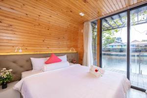 Ένα ή περισσότερα κρεβάτια σε δωμάτιο στο Bungalow Studio View Hồ Melly - Vũng Tàu