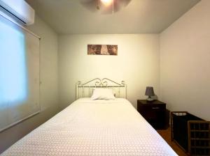 Ένα ή περισσότερα κρεβάτια σε δωμάτιο στο Hostel Pura Vida