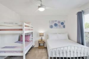 a bedroom with two bunk beds and a window at Private Beach and Pool in Gulf Shores +74 photos