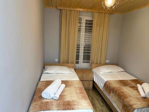 Postel nebo postele na pokoji v ubytování guesthouse twins in svaneti