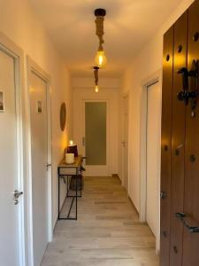 a hallway with a table and a desk in a room at Habitación Sant Jeroni en Casa Camí de les Aigües Monistrol de Montserrat in Monistrol