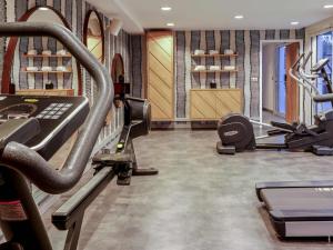 a gym with two treadmills and a treadmill at Mercure Marseille Centre Prado Vélodrome in Marseille