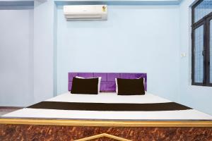 Voodi või voodid majutusasutuse Hotel O Om Sai Garden toas