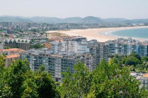 an aerial view of a city and a beach at EMAROOMS Laredo in Laredo