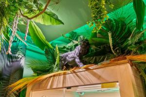 a wooden cabinet with plants on top of it at Jungle & Sauna in Chaville