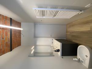 a bathroom with a toilet and a sink at Beut Home Apartments in Gavirate +46 photos