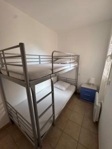 a bunk bed room with two bunk beds in it at BIJOU in Conca