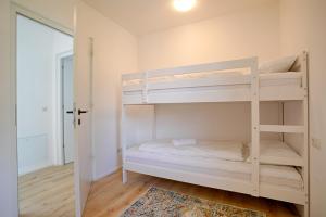 Ένα ή περισσότερα κρεβάτια σε δωμάτιο στο Naturns Apartment Mountain Suite