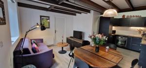 a living room with a couch and a table at Bleautiful "Blanche" Charmant duplex tout confort in Fontainebleau