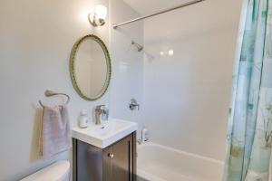 a white bathroom with a sink and a shower at Train to Boston! Cozy Apartment in Winchester in Woburn +16 photos