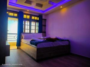 Postel nebo postele na pokoji v ubytování Resort Abhirup