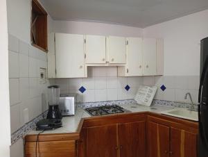 Kuchyň nebo kuchyňský kout v ubytování Condominio, Cabaña 202