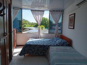 Postel nebo postele na pokoji v ubytování Condominio, Cabaña 202