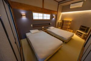 Ένα ή περισσότερα κρεβάτια σε δωμάτιο στο 海が見える1棟貸し!バレルサウナ付きの家族で泊まれる貸し別荘!絶景とプライベート空間を満喫!