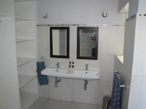 a bathroom with a sink and a mirror at 7 Vallen Lodge in Ballito +40 photos