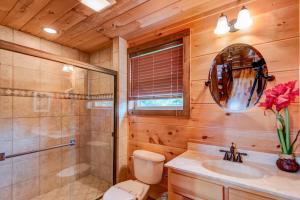 a bathroom with a toilet and a shower and a sink at 1 Awesome Skyview in Vilas +60 photos
