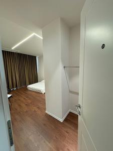 Ένα ή περισσότερα κρεβάτια σε δωμάτιο στο Minimalist studio appartment