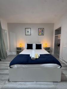 a bedroom with a large bed with two pillows at The Albion Hotel in Hull