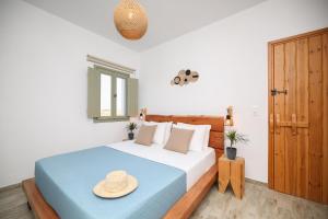a bedroom with a bed with a hat on it at Eleonas I in Maragkas