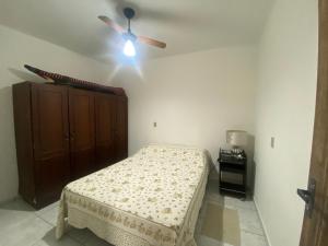 Кровать или кровати в номере Kitnet de temporada da Gi