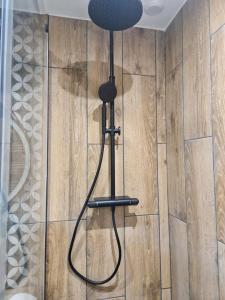 a black lamp in the corner of a room at PASTO GAUCHE Appartement Nice 6P in Nice