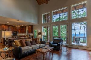 a living room with a couch and a table at Longview at Eagles Nest in Elk Park