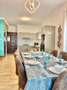 a dining room with a long table and chairs at Mont Oreb Villas Ambre Flic en Flac in Midlands Station