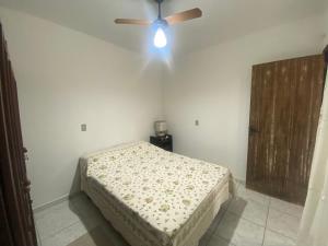 Кровать или кровати в номере Kitnet de temporada da Gi