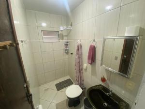 Ванная комната в Kitnet de temporada da Gi