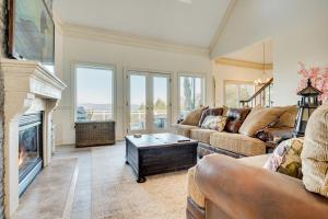 a living room with a couch and a fireplace at Million-Dollar Mtn Views! Gilford Gilded Loon in Glendale