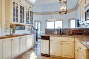 a kitchen with white cabinets and a sink at Million-Dollar Mtn Views! Gilford Gilded Loon in Glendale