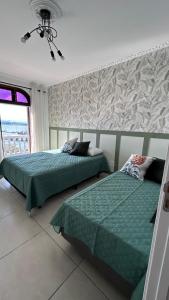 Postel nebo postele na pokoji v ubytování Casa Mirante do Mar Floripa + 23 fotografií