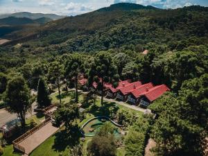an overhead view of a building with a red roof at Pousada das Pedras in Monte Verde +104 photos