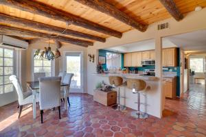 a kitchen and dining room with a table and chairs at Pool and Stunning Mtn Views! Eclectic Tucson Home in Tucson