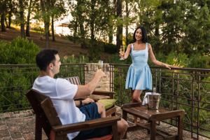 a woman holding a glass of wine and a man at Villa Adele - Historic Dimora with pool & sea view in Senigallia +82 photos