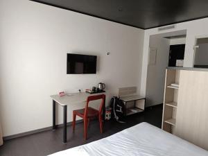 TV a/nebo společenská místnost v ubytování Blessing Apartment Near Convention Center