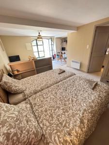 a bedroom with a large bed in a room at Domaine de Cassan in Lafare +65 photos