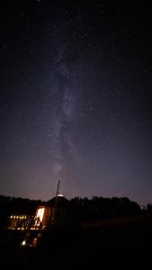 a starry night with the milky way in the sky at Łąka Gwiazd Jurty Czapla in Wałcz +46 photos
