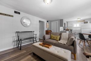 a living room with a couch and a table at Current Cottage Waterside 1 Bed 1 Ba Private Pond in Bradford