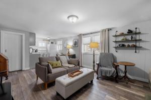 a living room with a couch and a chair at Current Cottage Waterside 1 Bed 1 Ba Private Pond in Bradford