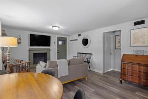 a living room with a couch and a table at Current Cottage Waterside 1 Bed 1 Ba Private Pond in Bradford +18 photos