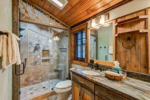 a bathroom with a shower and a toilet and a sink at Rivers Edge at Eagles Nest in Banner Elk +62 photos