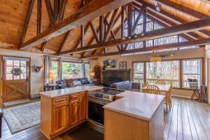 a large kitchen with wooden floors and wooden ceilings at Bear Valley in Fleetwood