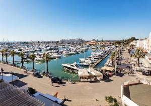 a marina filled with lots of boats in the water at Marina Plaza by Garvetur in Vilamoura