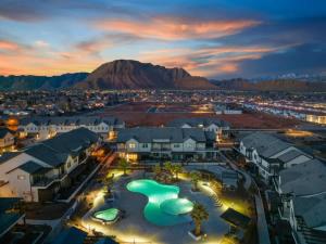 a view of a resort with a pool at night at 30-31| 2 Homes in St George with Private Pools and Hot Tubs in Santa Clara +96 photos