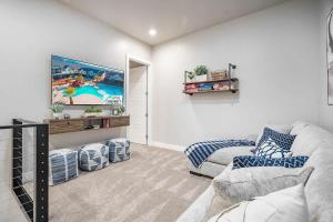 a living room with a couch and a tv at 29-30 | 2 Connected Homes in Ocotillo Springs with Pool and Spas in Santa Clara